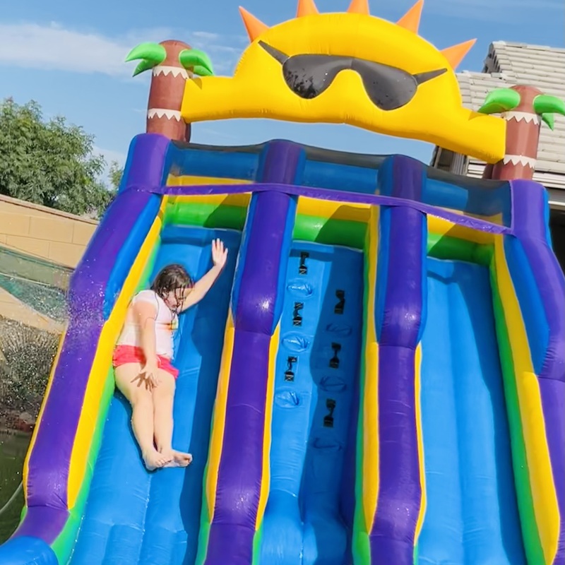 22ft Sun Shine Adventure Features
•Dual Slide Fun for Kids- Two side-by-side slide lanes let kids race, slide, and splash together, making it great for backyard play, birthday parties, and summer gatherings.
• Large Backyard Water Play Area - The built-in climbing wall, water sprayers, and splash pool create a complete backyard water park experience for active outdoor fun.
• Durable Oxford Fabric - Made from Oxford fabric for a lightweight yet durable design, suitable for residential backyard use and easy to fold away after play.
• Wet & Dry Play Options - Connect a garden hose for refreshing water play, or use it as a dry inflatable slide for everyday outdoor entertainment.
• Quick Setup with Included Blower - Comes with an air blower, stakes, water sprayer nozzle, and repair patches for simple setup and continuous inflation during use.